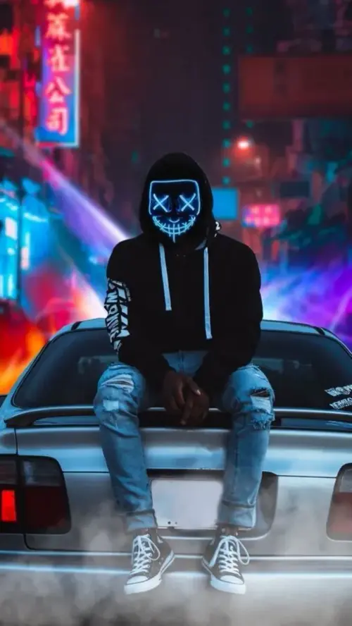 Image "A guy in a cool neon mask sitting on a car" (507x900)