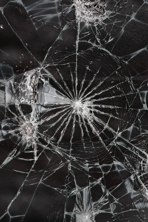 Image "Broken glass with characteristic cracks radiating from the center" (2592x3888)