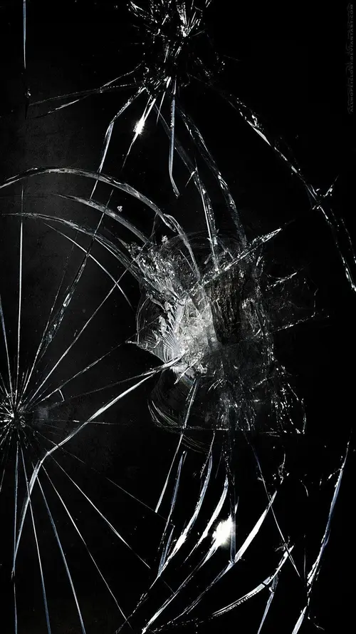 Image "A broken phone screen with numerous cracks" (1080x1920)