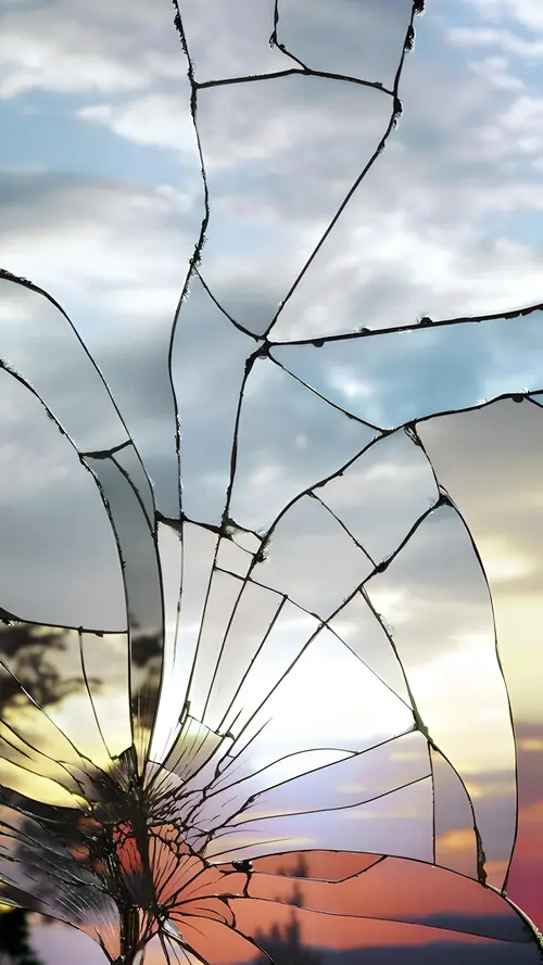 Image "Mirrored broken glass with sunset reflection" (2000x3556)