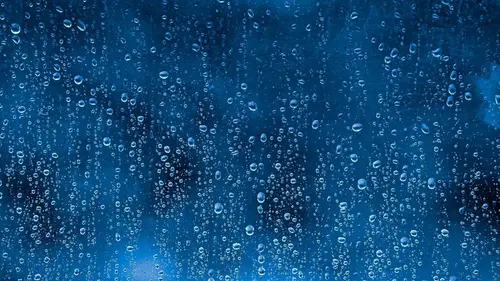 Image "Drops of rain on the glass against the background of the blue sky" (1920x1080)